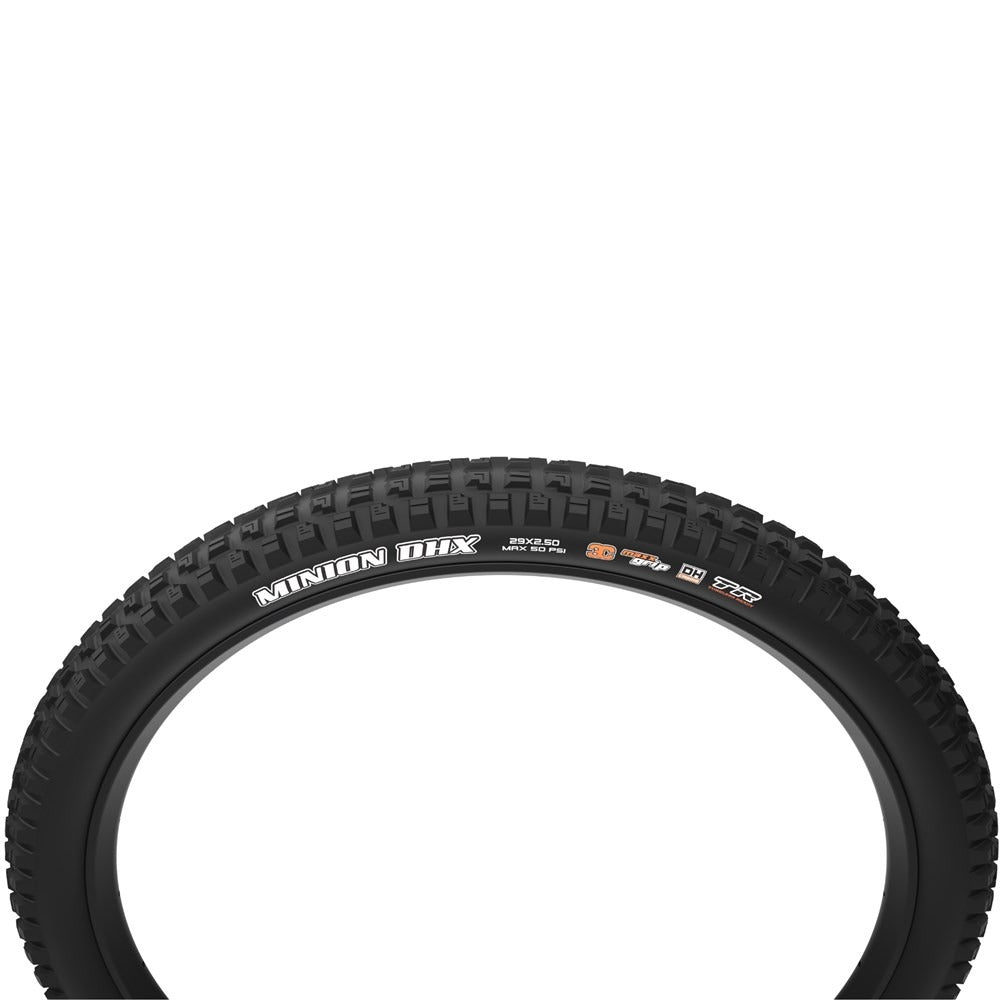 A black mountain bike tyre with white 'MINION DHX' branding on the sidewall, shown against a solid white background.