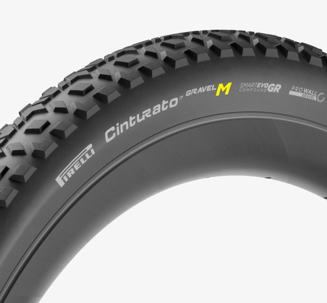 Close-up of a Pirelli Cinturato Gravel M tyre with tread pattern and branding on a white background