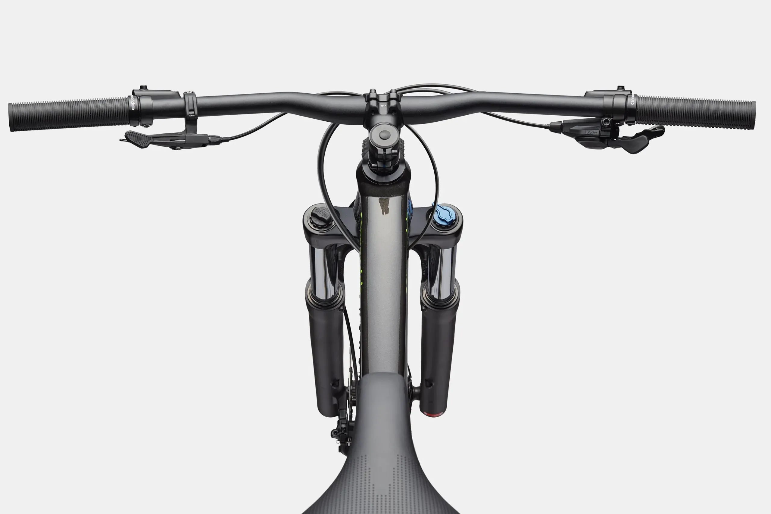Close-up of a bicycle handlebar and front suspension fork on a white background
