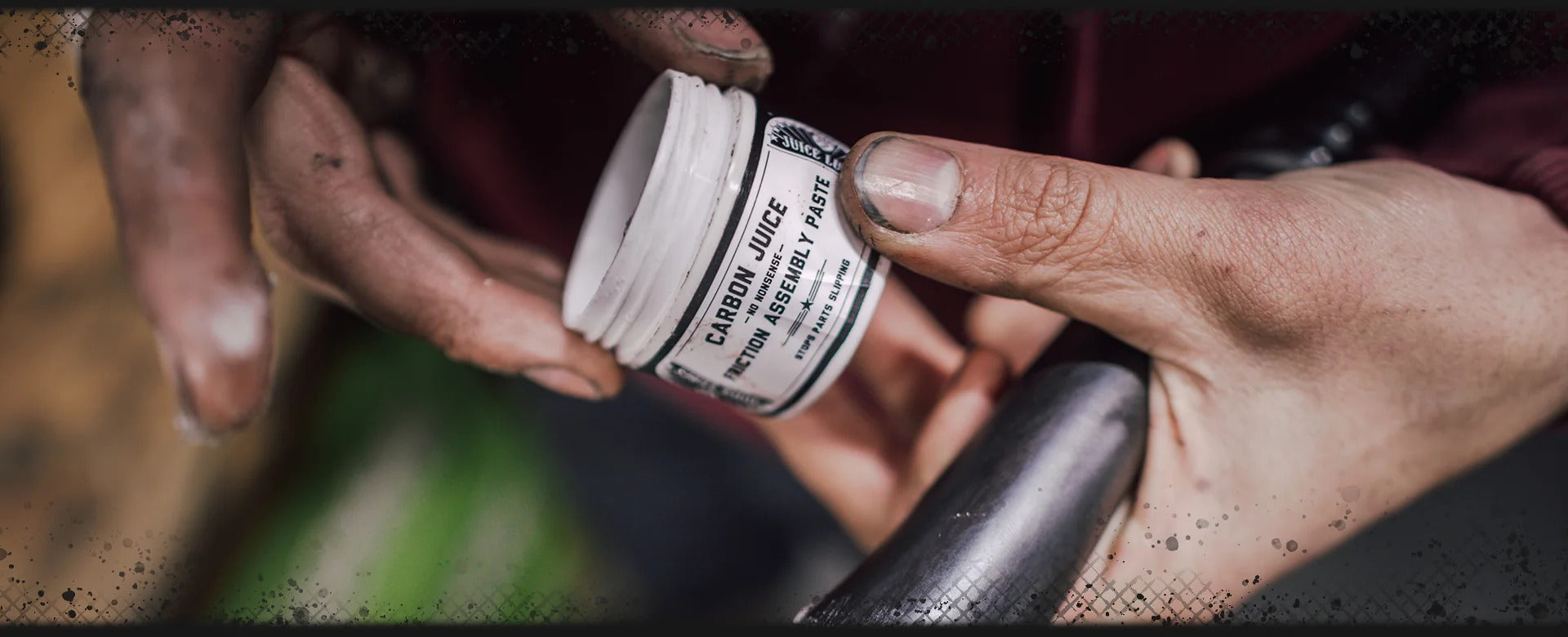 Close-up of hands holding the Juice Lubes Carbon Paste