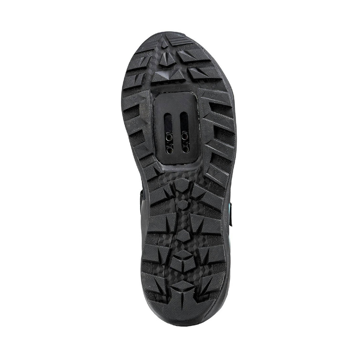 The underneath view of a black bicycle shoe sole showing the SPD Cleat bolt holes with aggressive tread patterns shown on a plain white background.