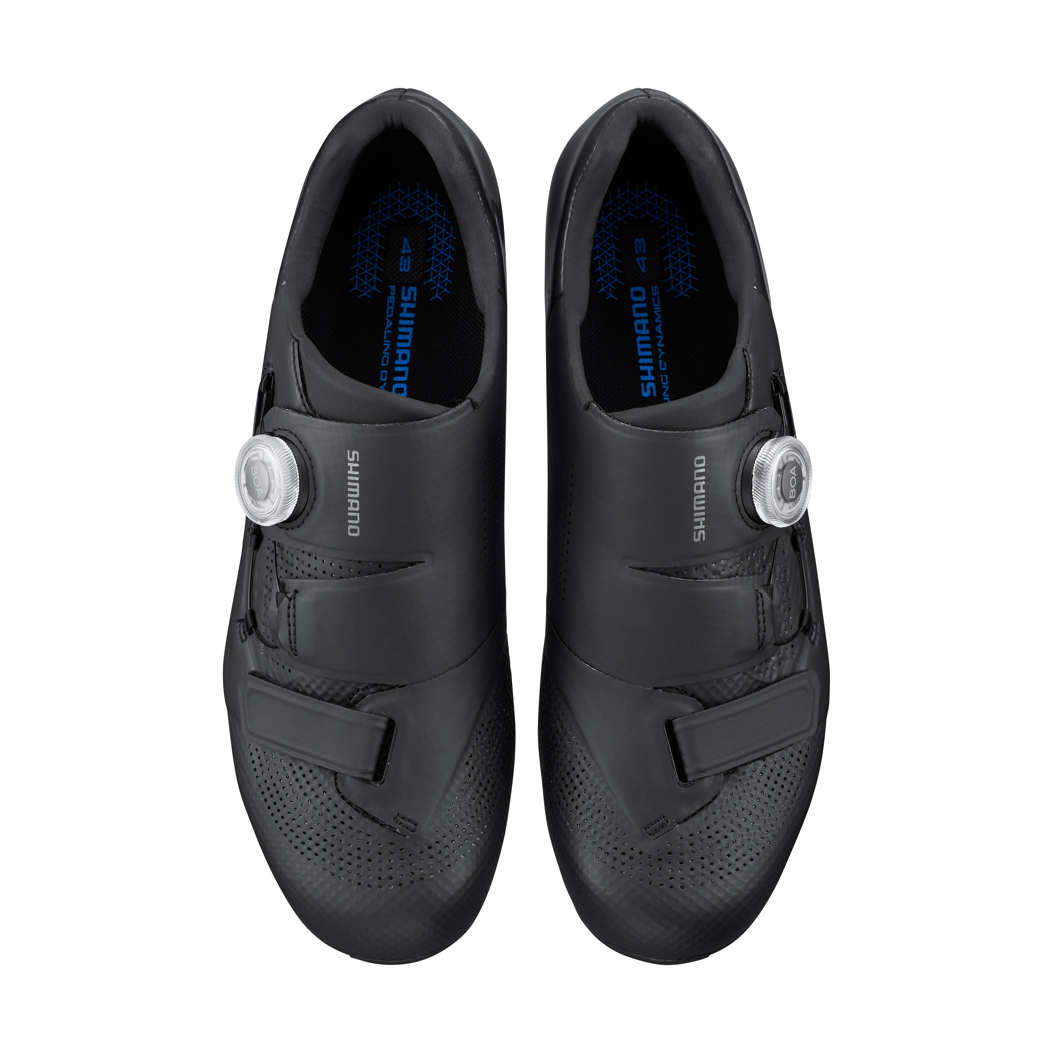 Pair of black Shimano cycling shoes on a white background