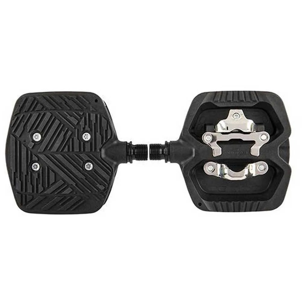 Double sided pedals, flat on one side and cleat on the other on a white background