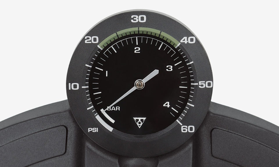 Close-up of a bike tyre pressure gauge with a white background