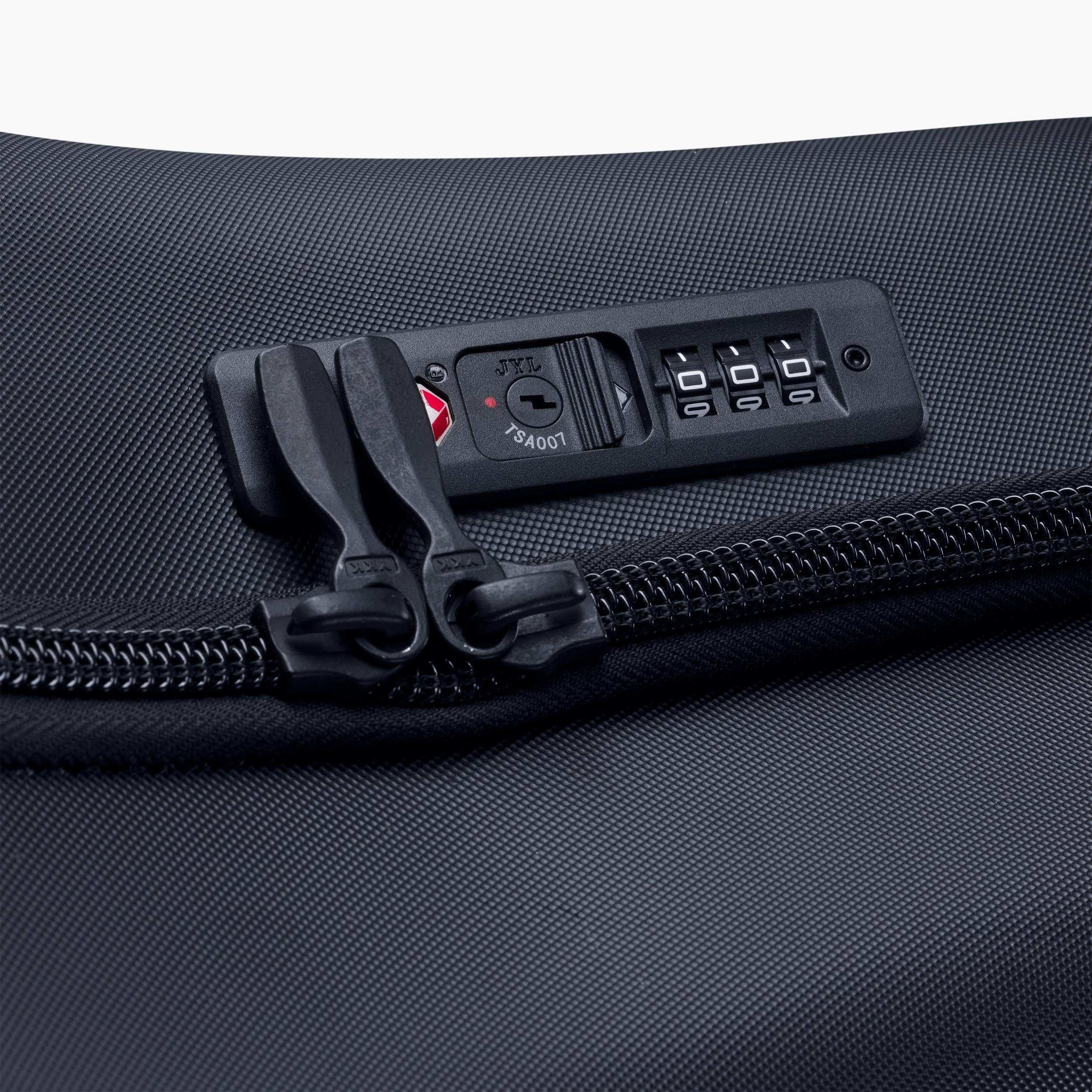 Close-up of a black bike travel bag with a TSA-approved lock on a white background
