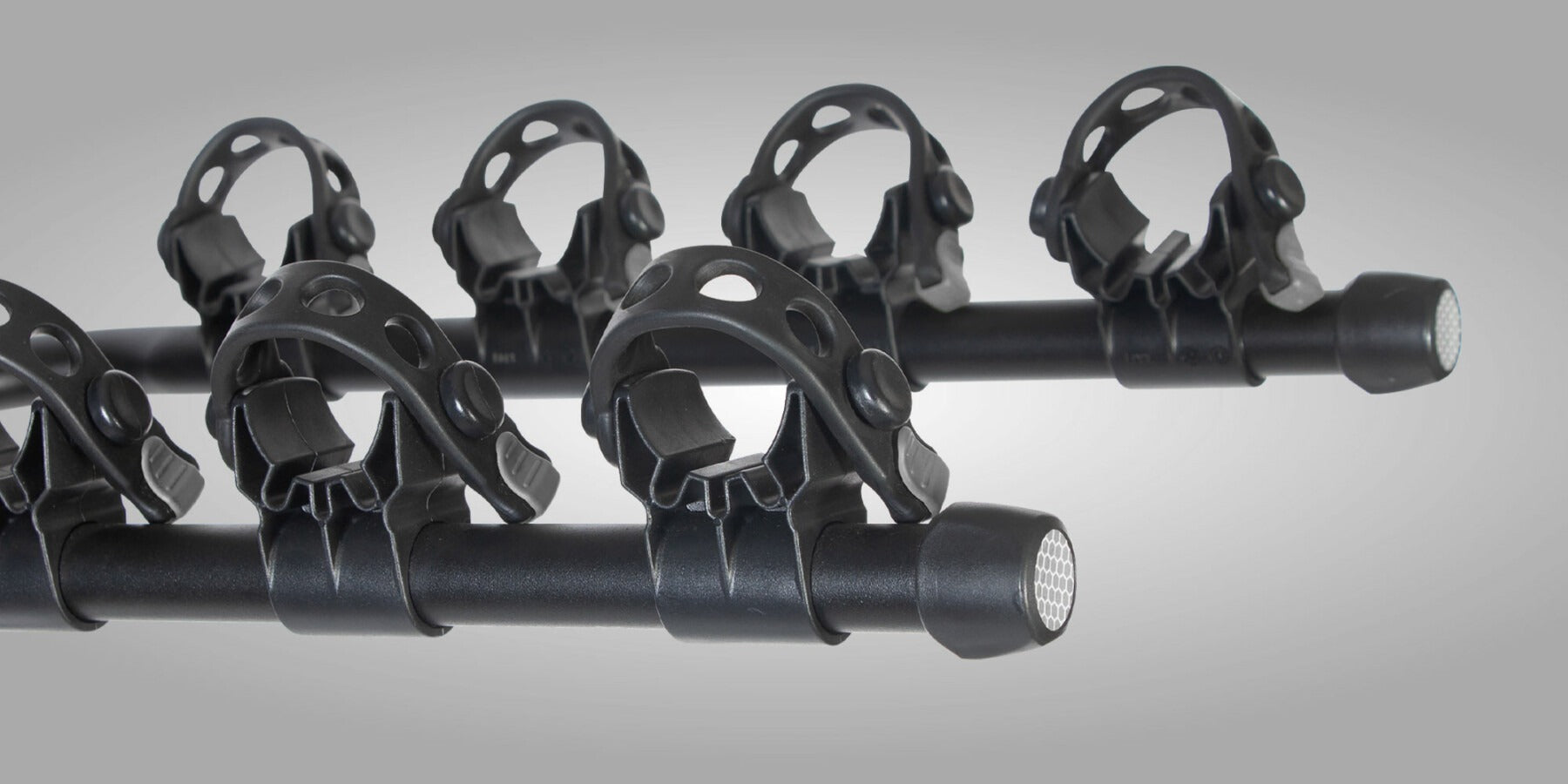 Close up of the straps on a bike rack on a gray background
