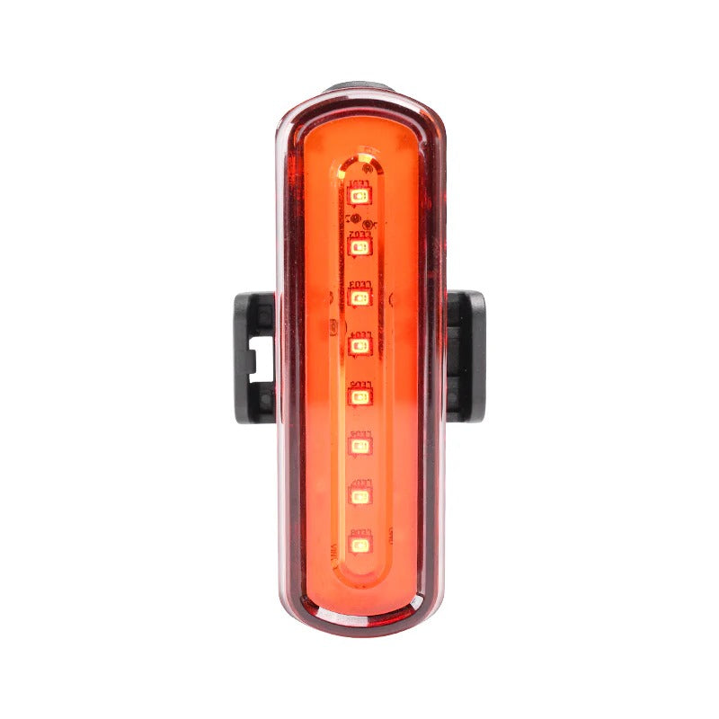 Red LED bicycle light on a white background