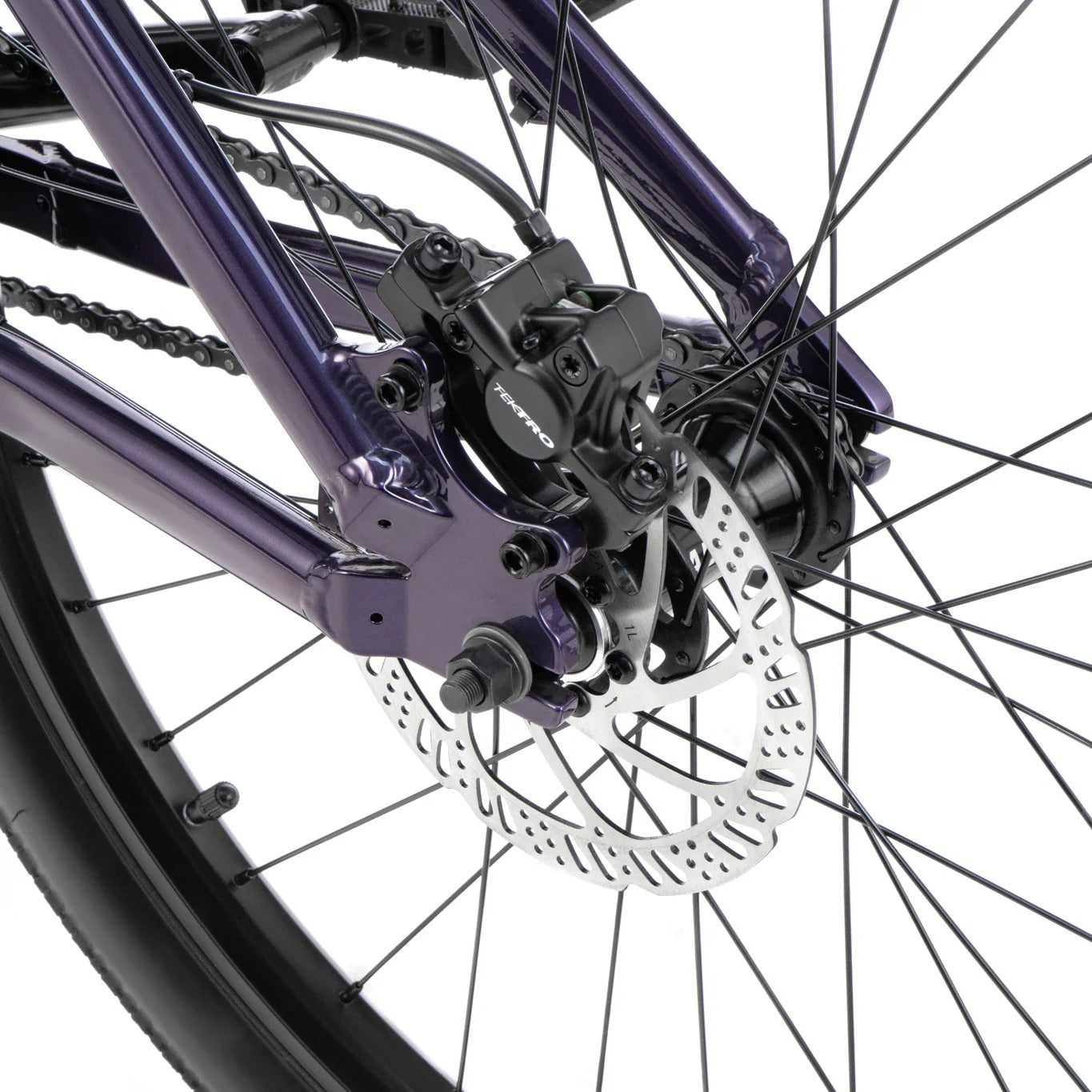 Close-up of a bicycle wheel with disc brake system on a white background