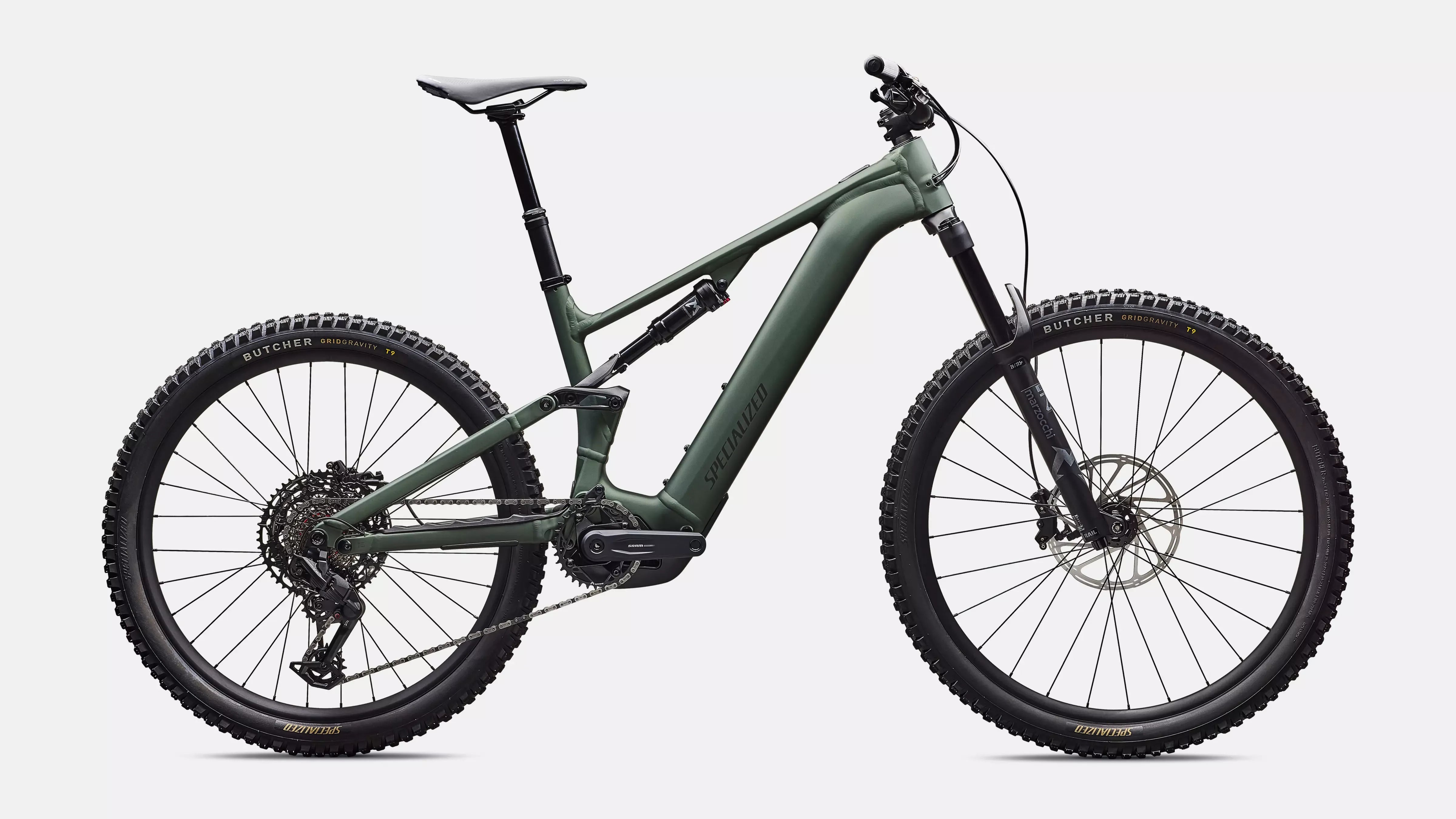 Green Specialized electric mountain bike on a white background