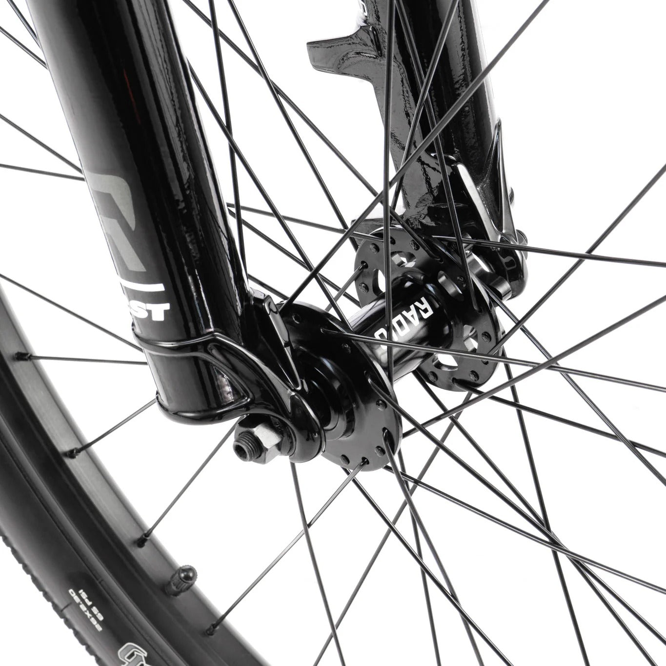 Close-up of a bicycle wheel with black components on a white background