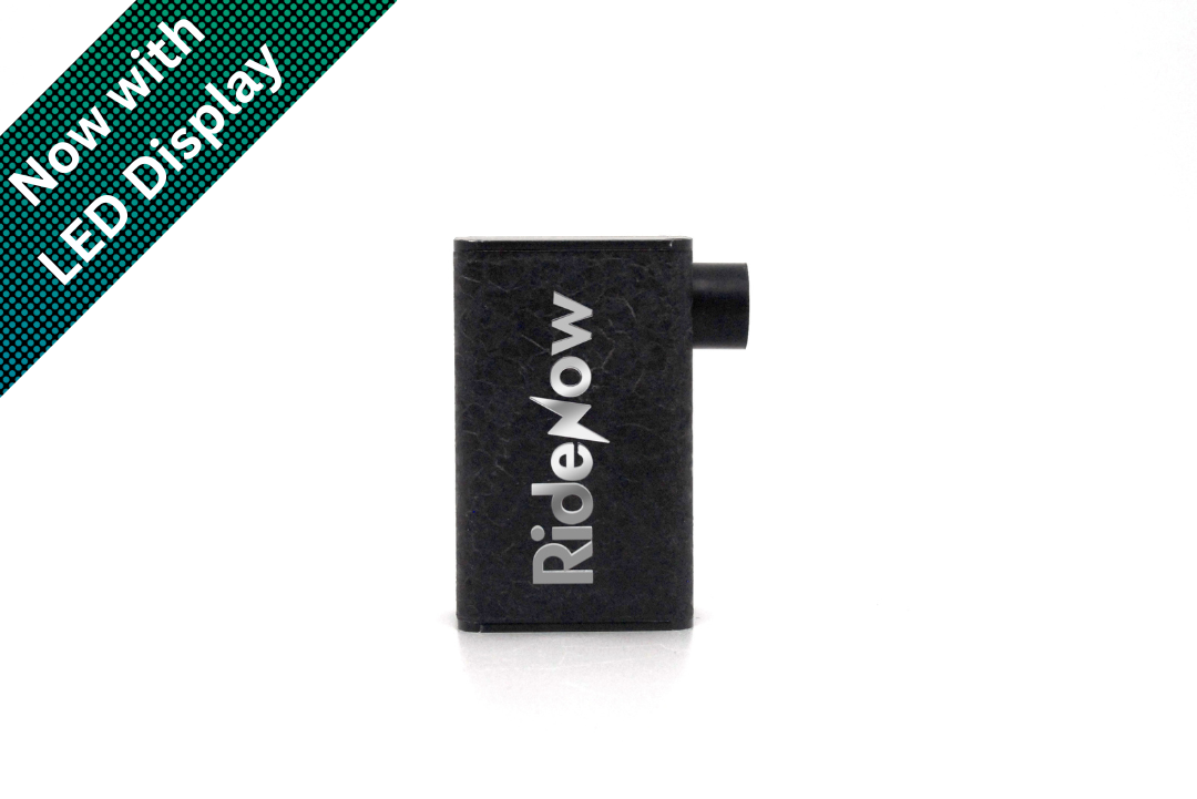 A black rectangular RideNow electric pump with a small protruding side tab, shown on a white background with a green diagonal banner reading 'Now with LED Display'.