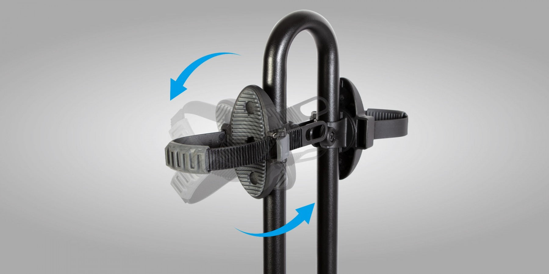 Close up of the top of a bike rack with adjustable strap on a gray background