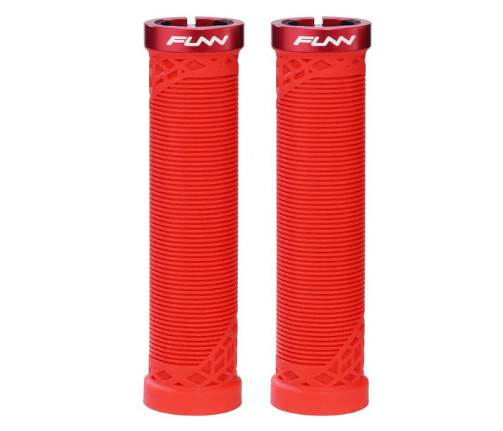 Two red bicycle handlebar grips with a ribbed texture and geometric cutouts, featuring a red top cap with the white 'FUNN' brand logo, shown on a plain white background.
