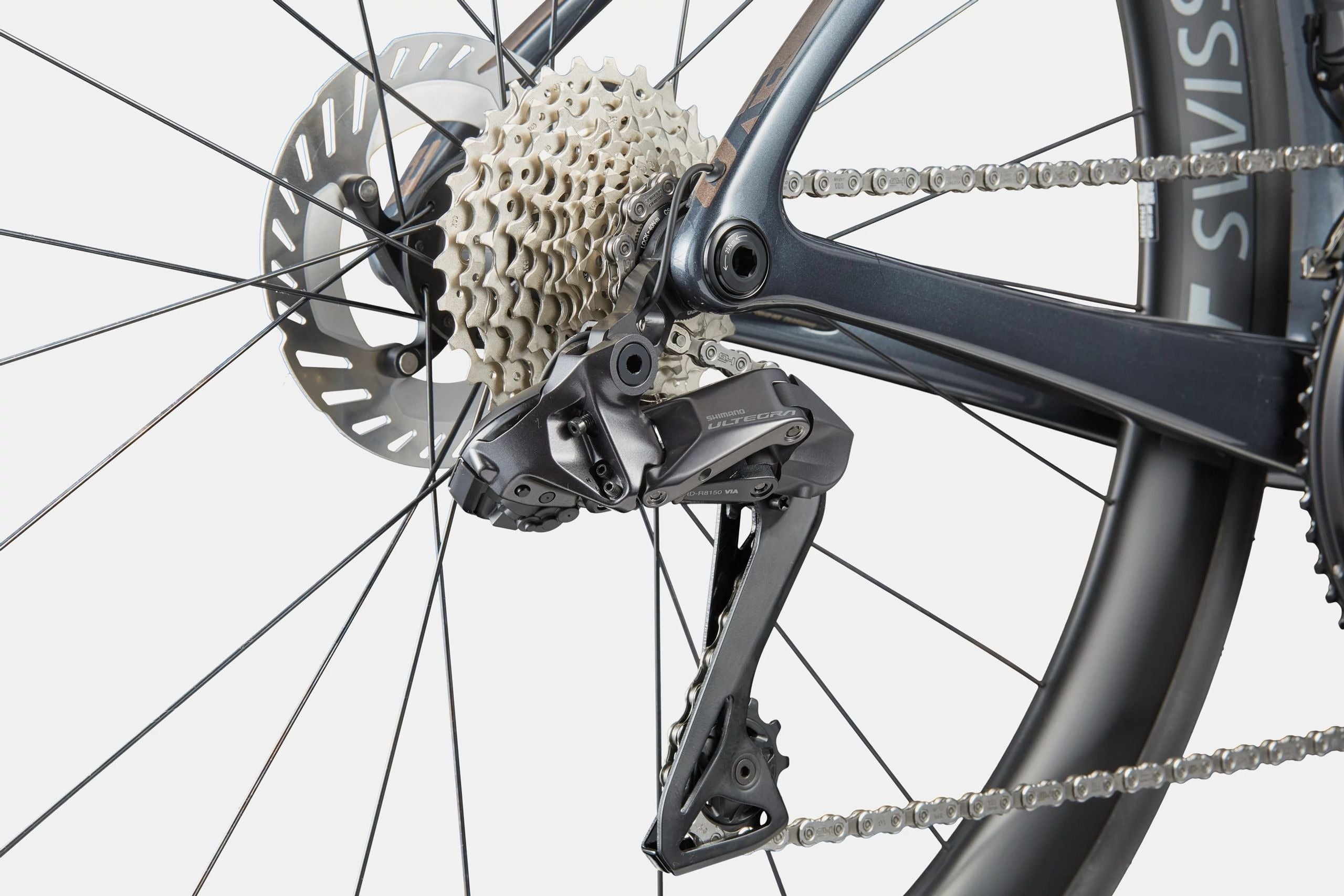 Close-up of a bicycle's gear system on a white background