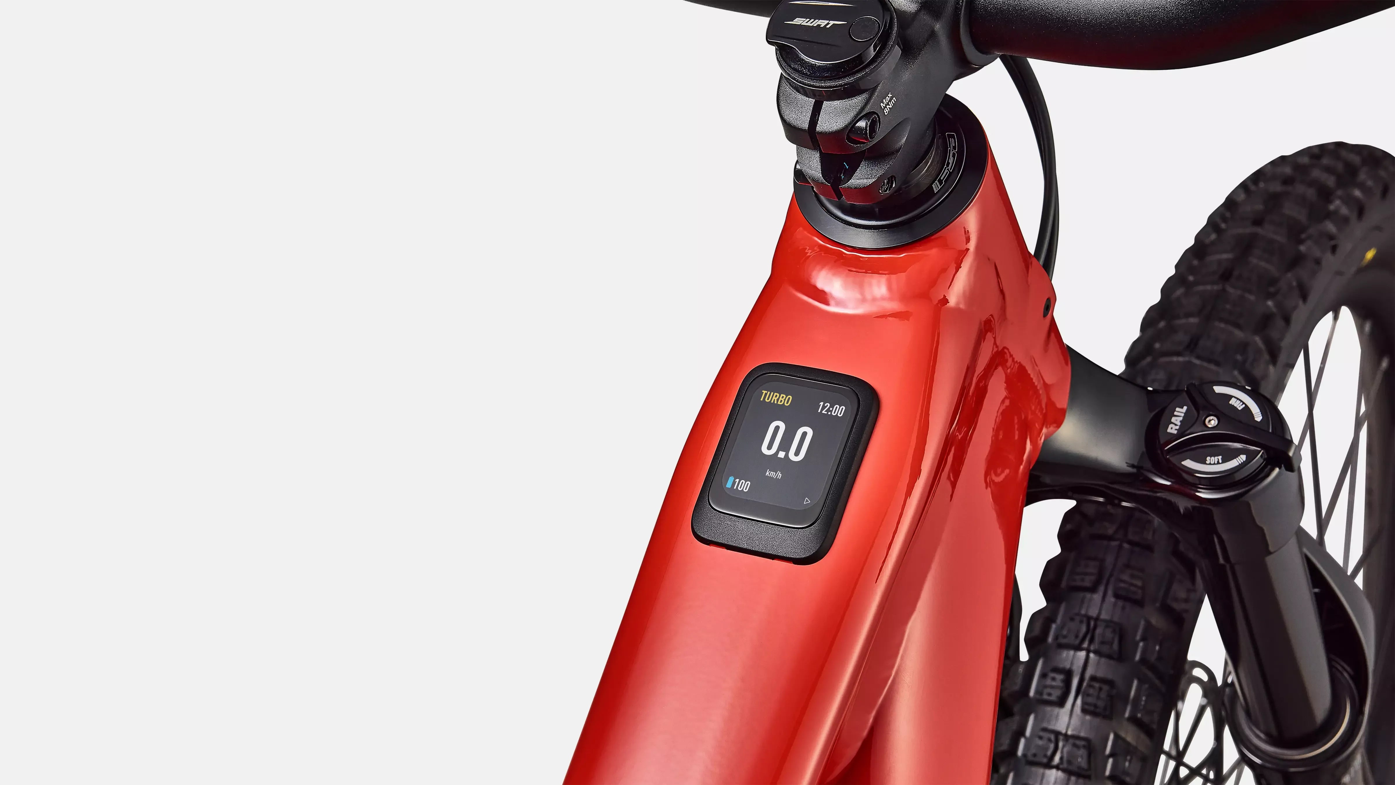 Close-up of a red electric bike with a digital display on a white background