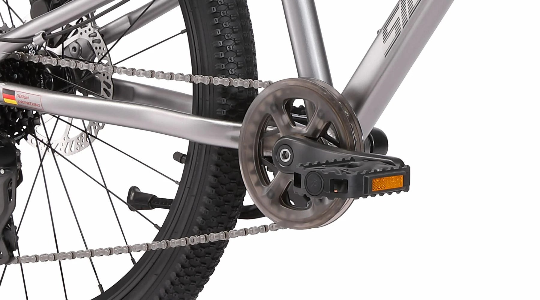 Close-up of a bicycle chain and gear system on a white background