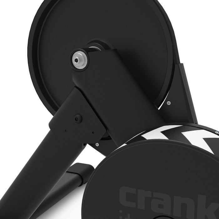 Close-up of a black exercise bike with 'crank' branding on a white background