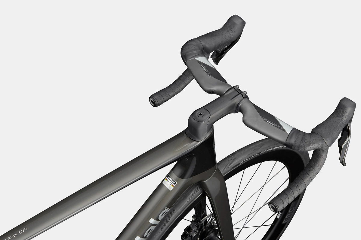 Close-up of a road bike aero drop handlebar and frame on a white background