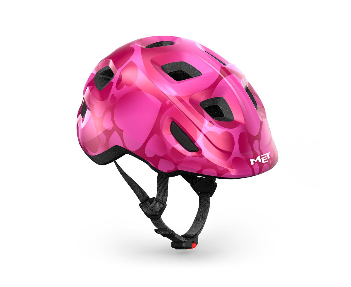 Pink kids' helmet with hearts on a white background