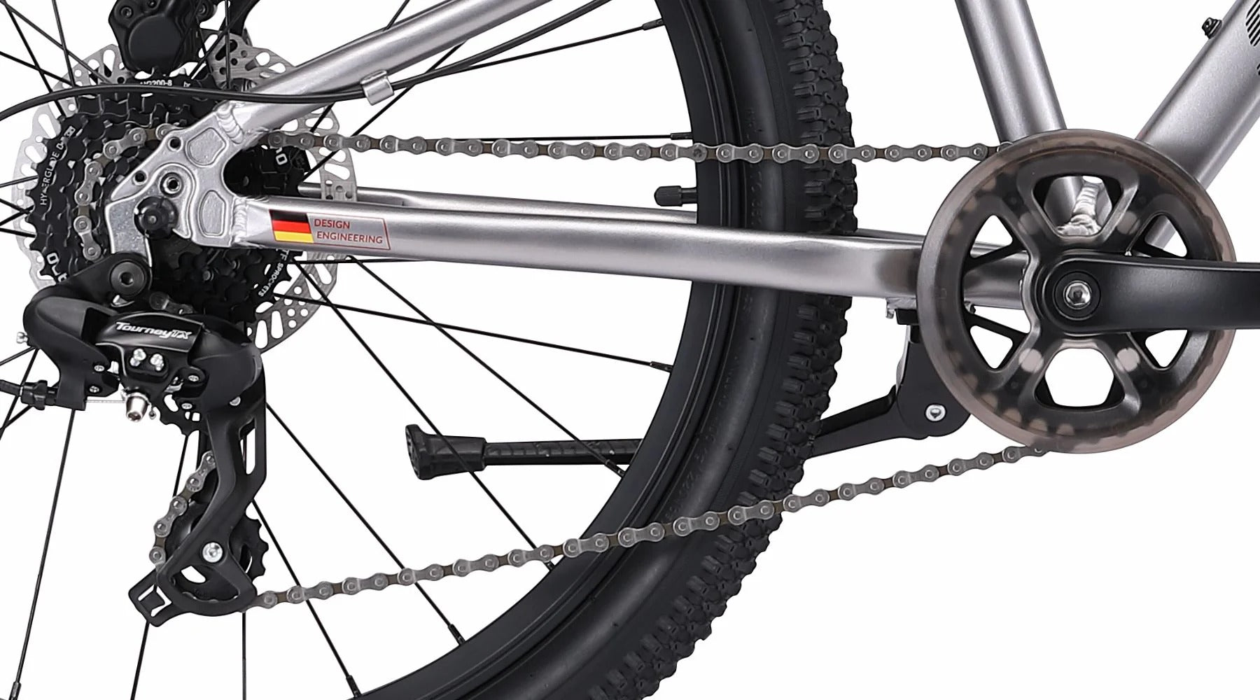 Close-up of a bicycle chain and gear system on a white background