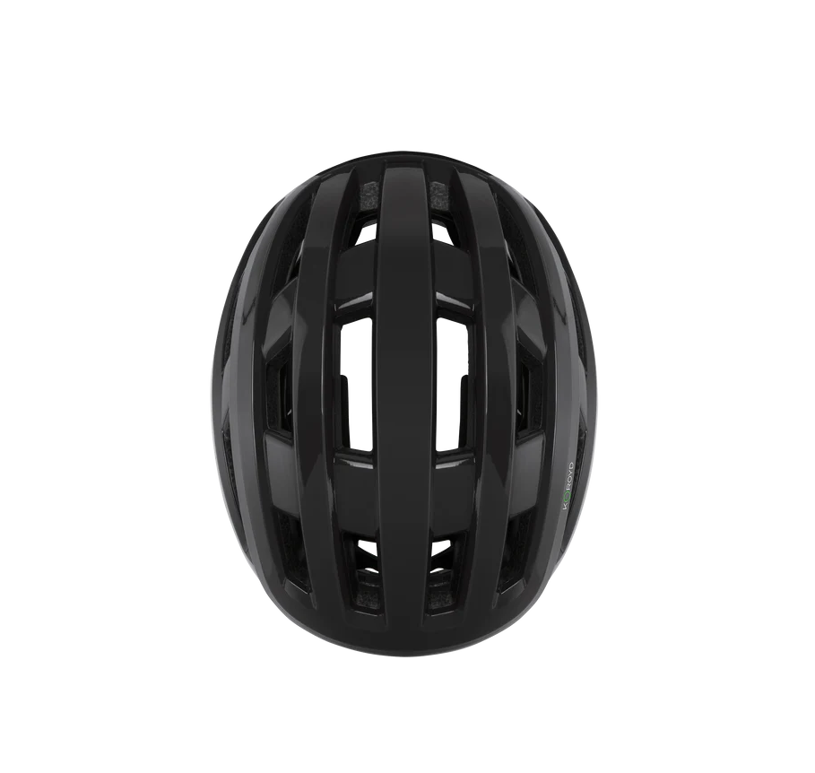 Birds eye view of a black road bike helmet on a white background