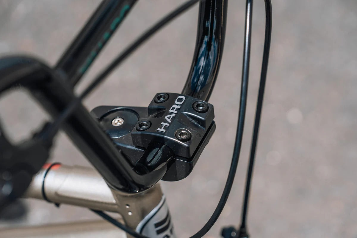 Close-up of a BMX Bike handlebar with 'Haro' branding on a blurred background