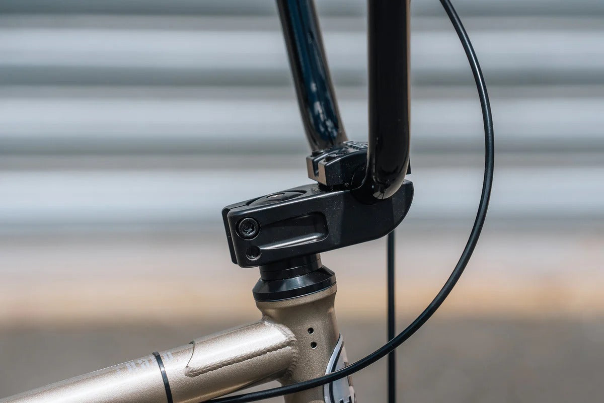 Close-up of a BMX Bike handlebar with a blurred background