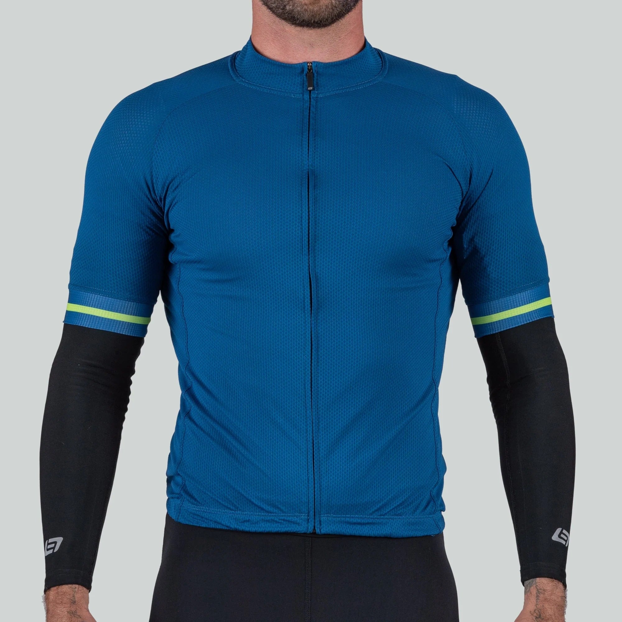 Blue cycling jersey with black arm sleeves and green accents on a gray background