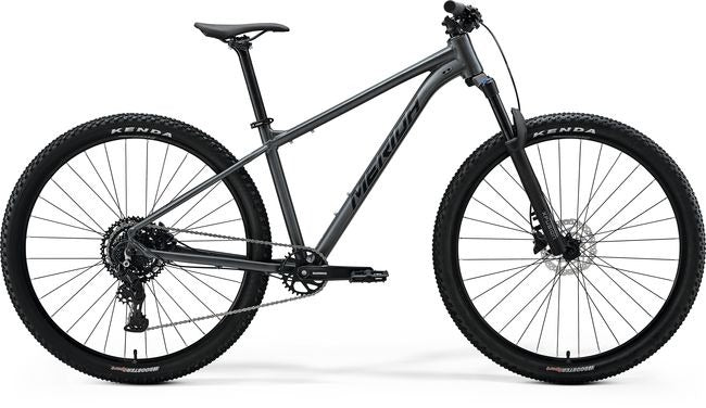 Gray Merida mountain bike on a white background