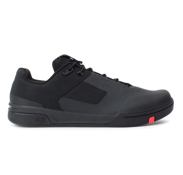 Black mountain bike flat shoe with a red label on a white background