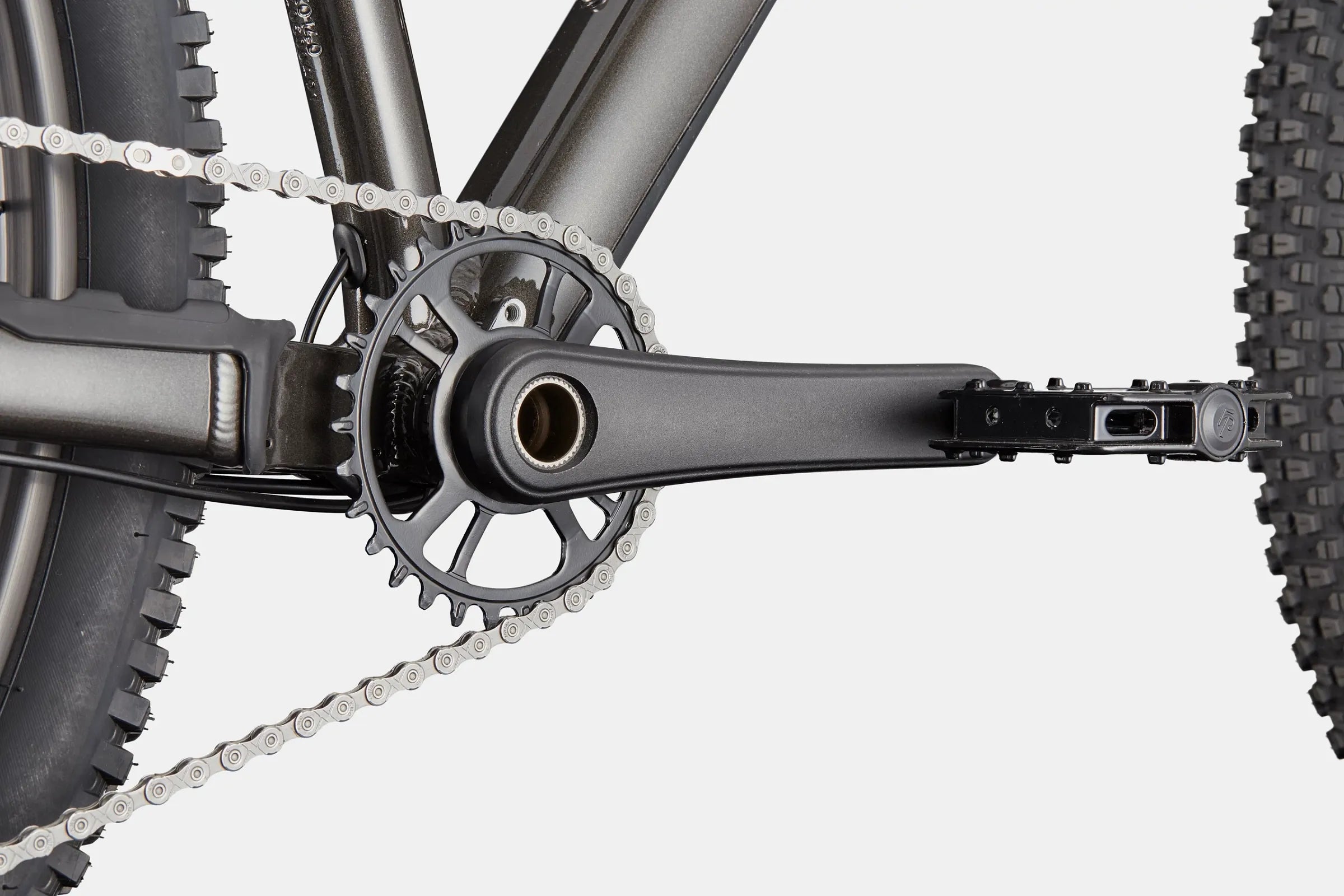 Close-up of a bicycle chain and gear system on a white background