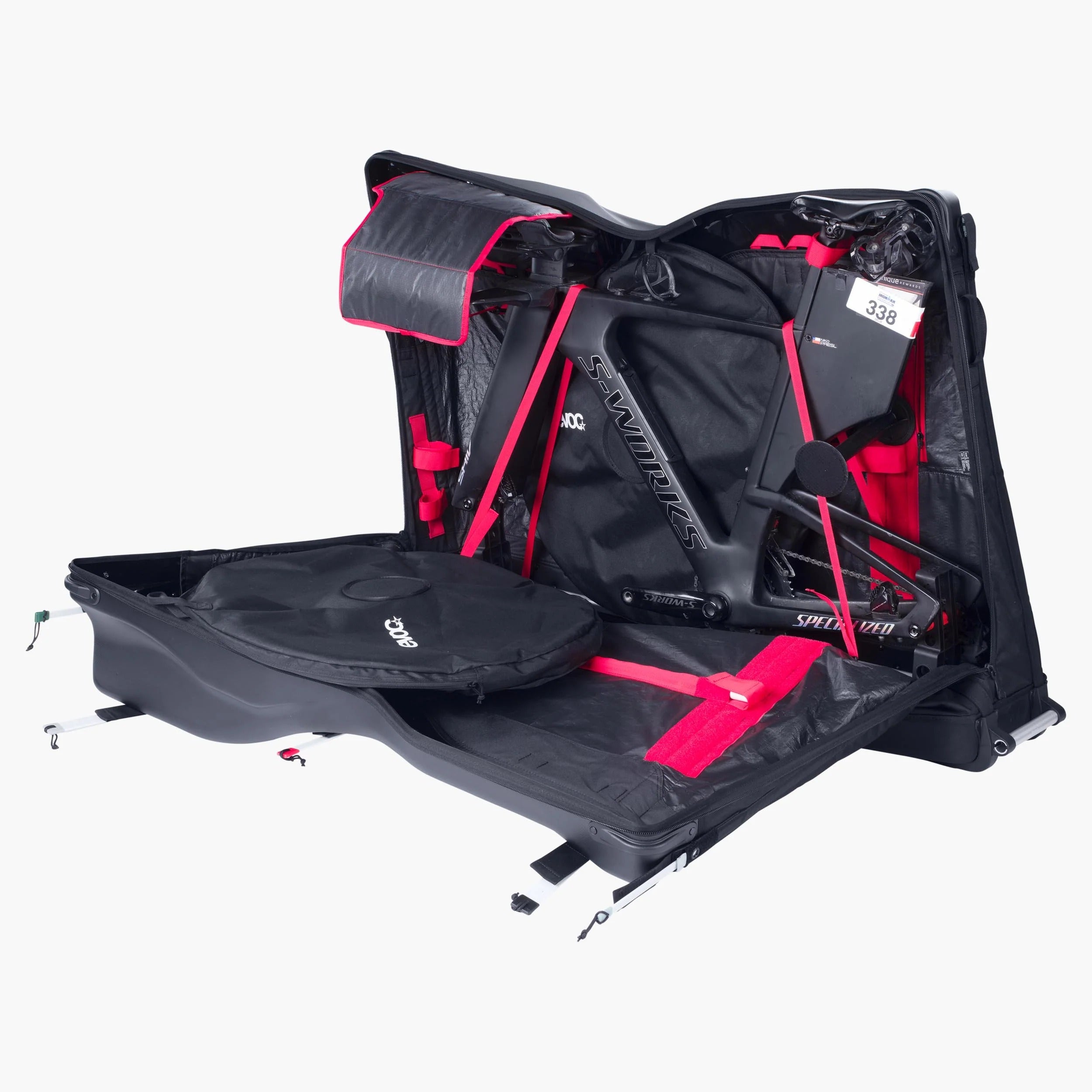 A black bike travel bag unzipped showing a bike being transported on a white background