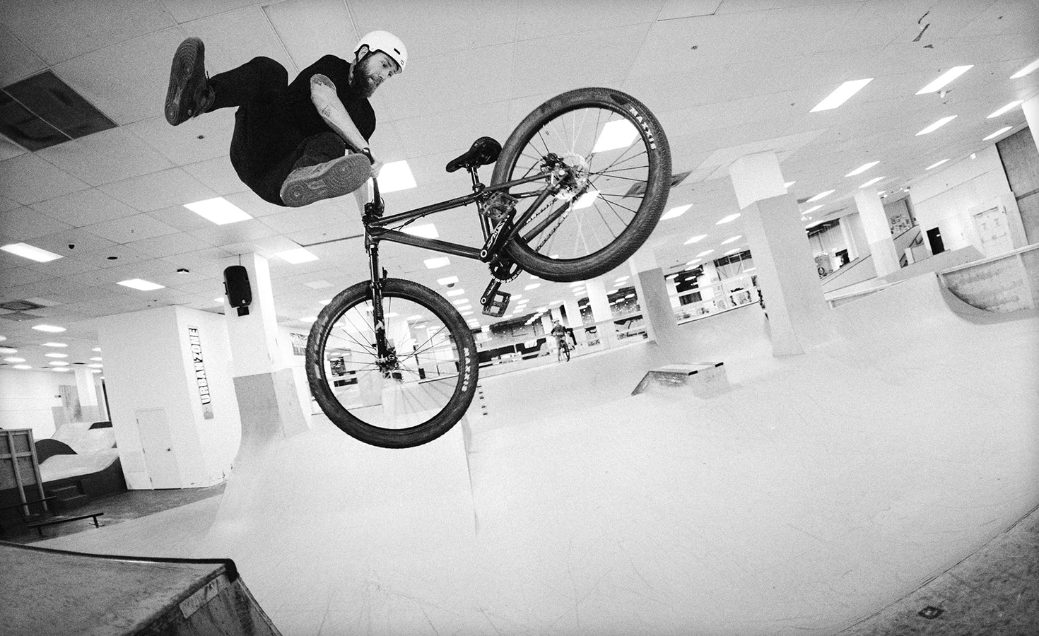 A guy doing a trick on the Norco Rampage 1 Dirt Jumper Bike