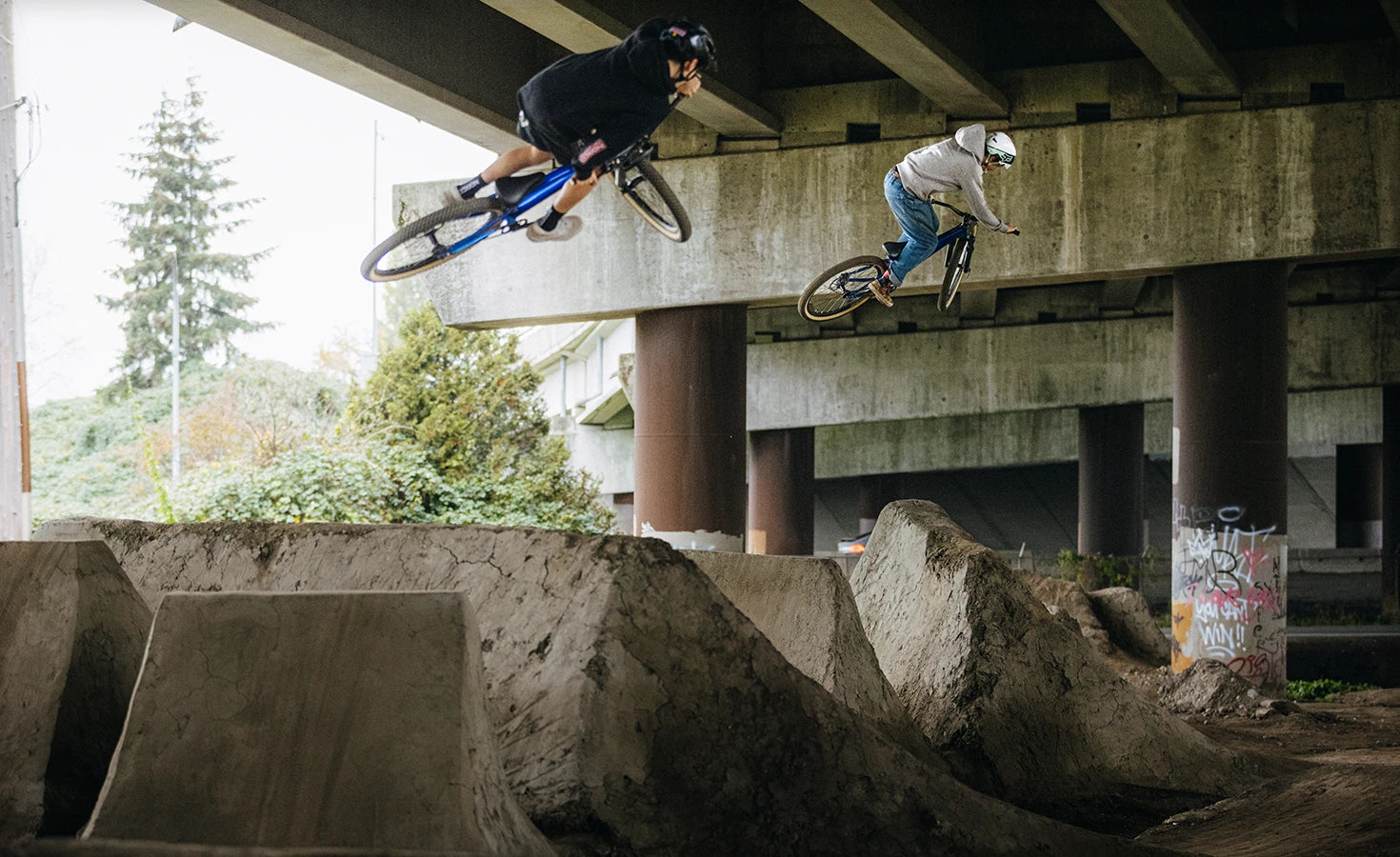 A picture of kids riding the Norco Rampage 24 Youth Dirt Jumper Bikes