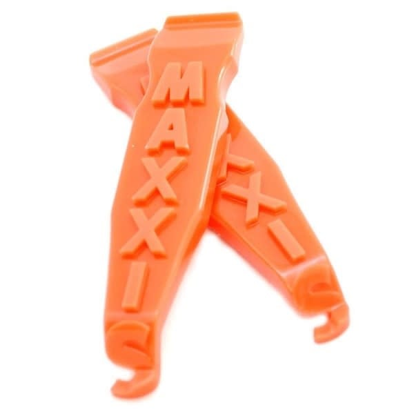 Two orange Maxxis branded tyre levers designed for bicycles.