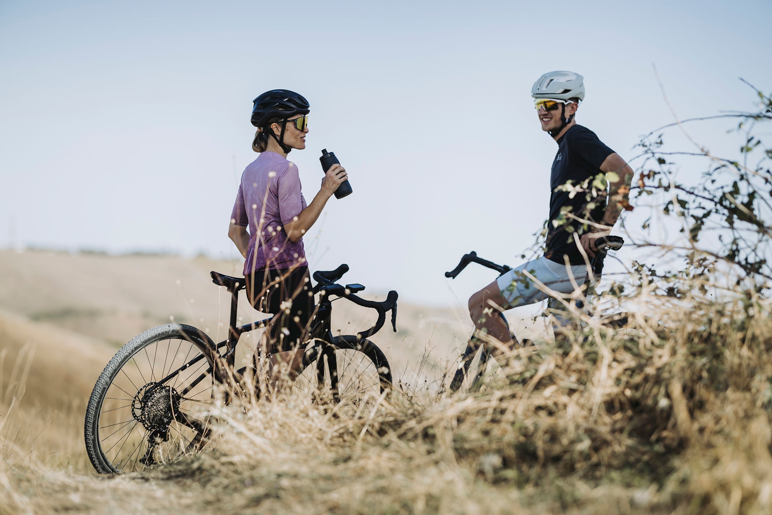 A picture of two cyclists riding gravel bikes