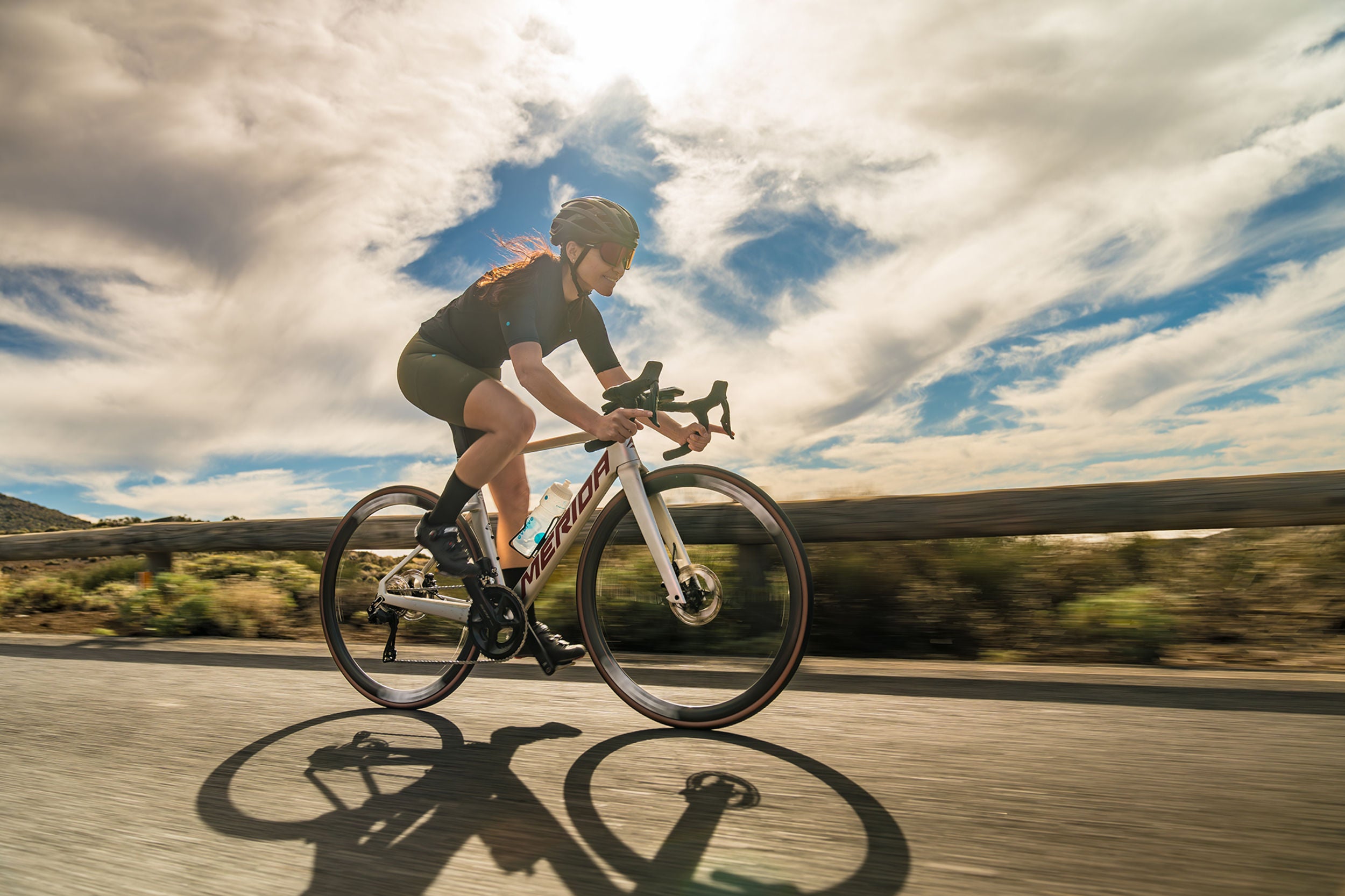 A picture of a girl riding a Merida Road Bike