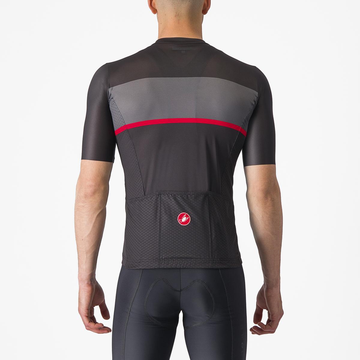 Person wearing a black and gray cycling jersey with a red stripe on a white background