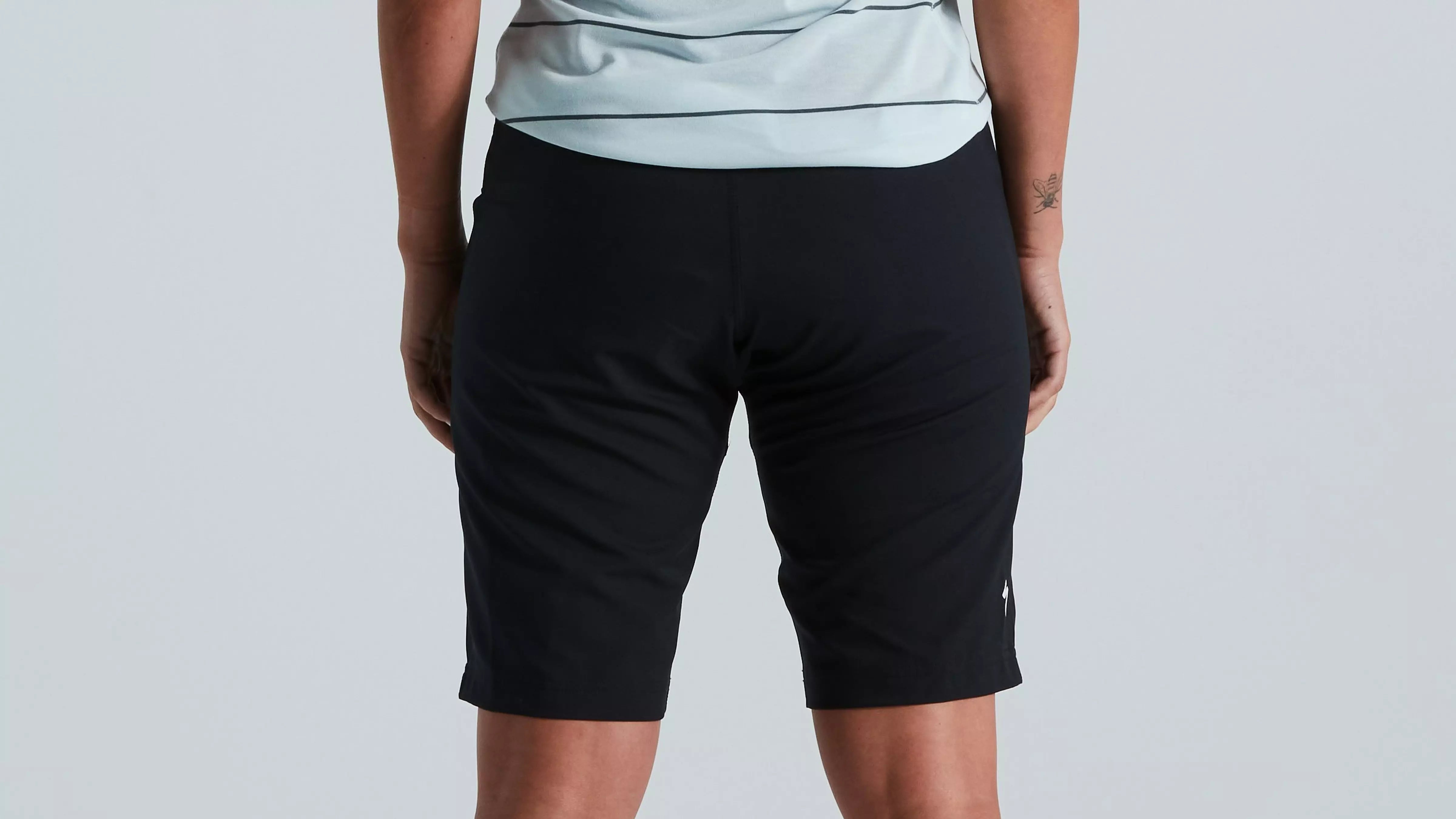 A picture of the back of a lady wearing mountain bike shorts