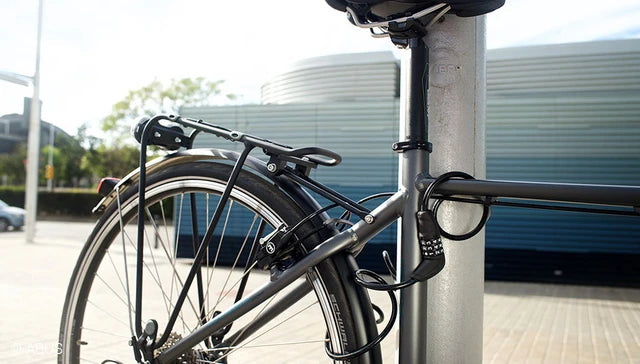 A picture of bicycle locked to pole with ABUS Primo Coil Lock