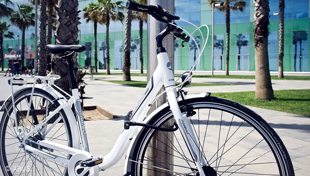 A picture of a bike locked to pole