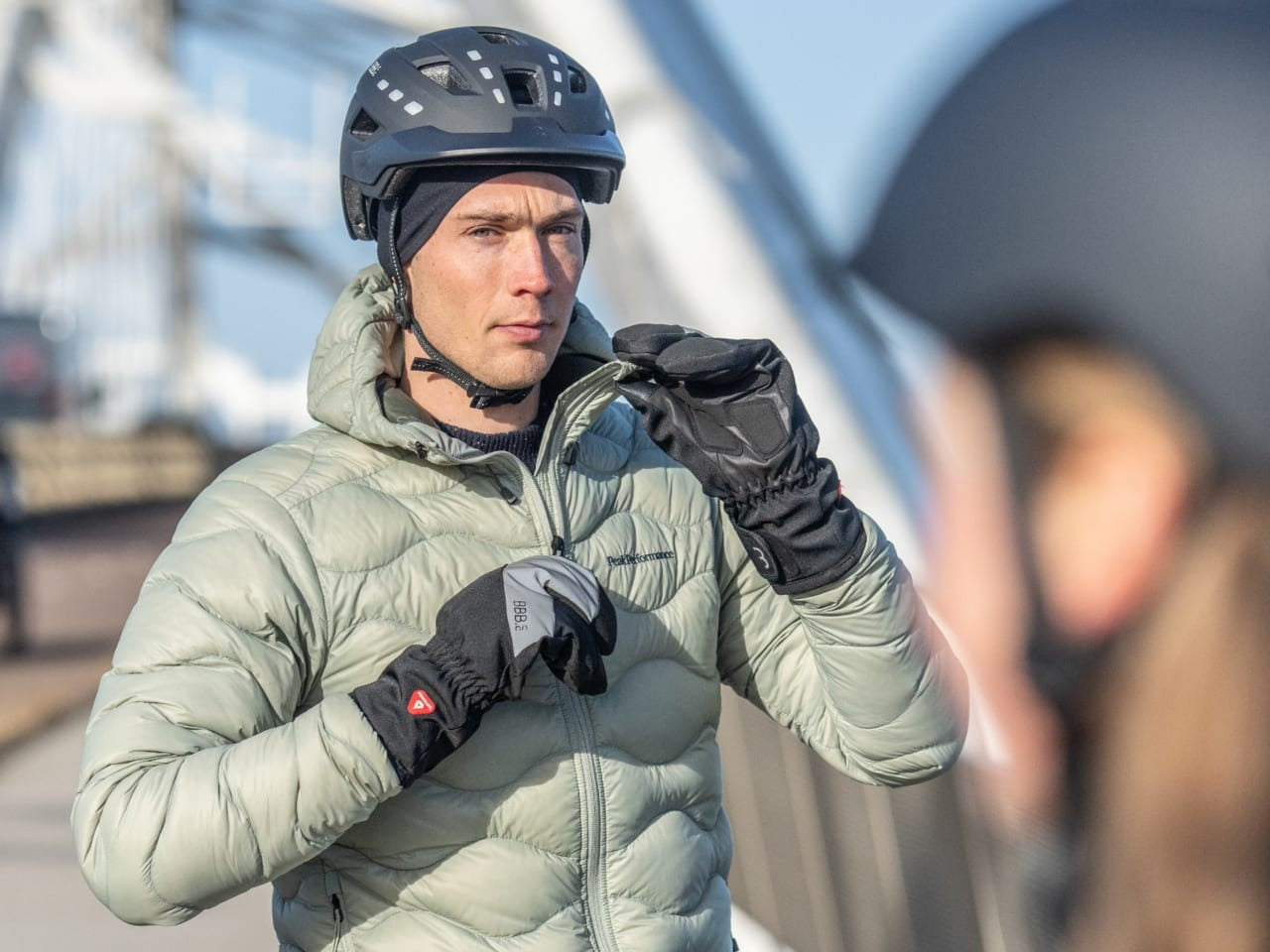 A picture of a mountain biker wearing a thermal skull cap under helmet