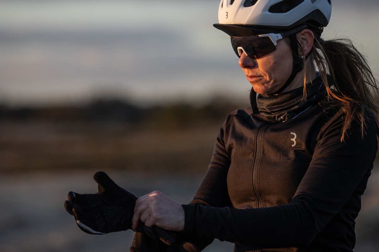 A picture of a lady putting on the BBB BWG-36 Control Zone Winter Gloves