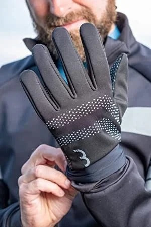 Person wearing a black cycling winter glove with the BBB brand logo, holding another glove.