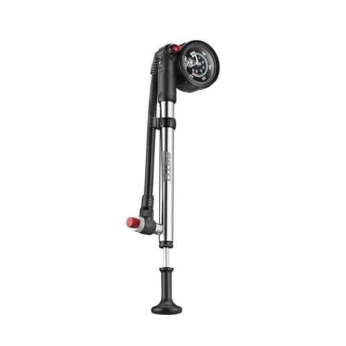 A silver alloy bicycle shock pump with a precision pressure gauge, a swivel hose, and a T-handle.