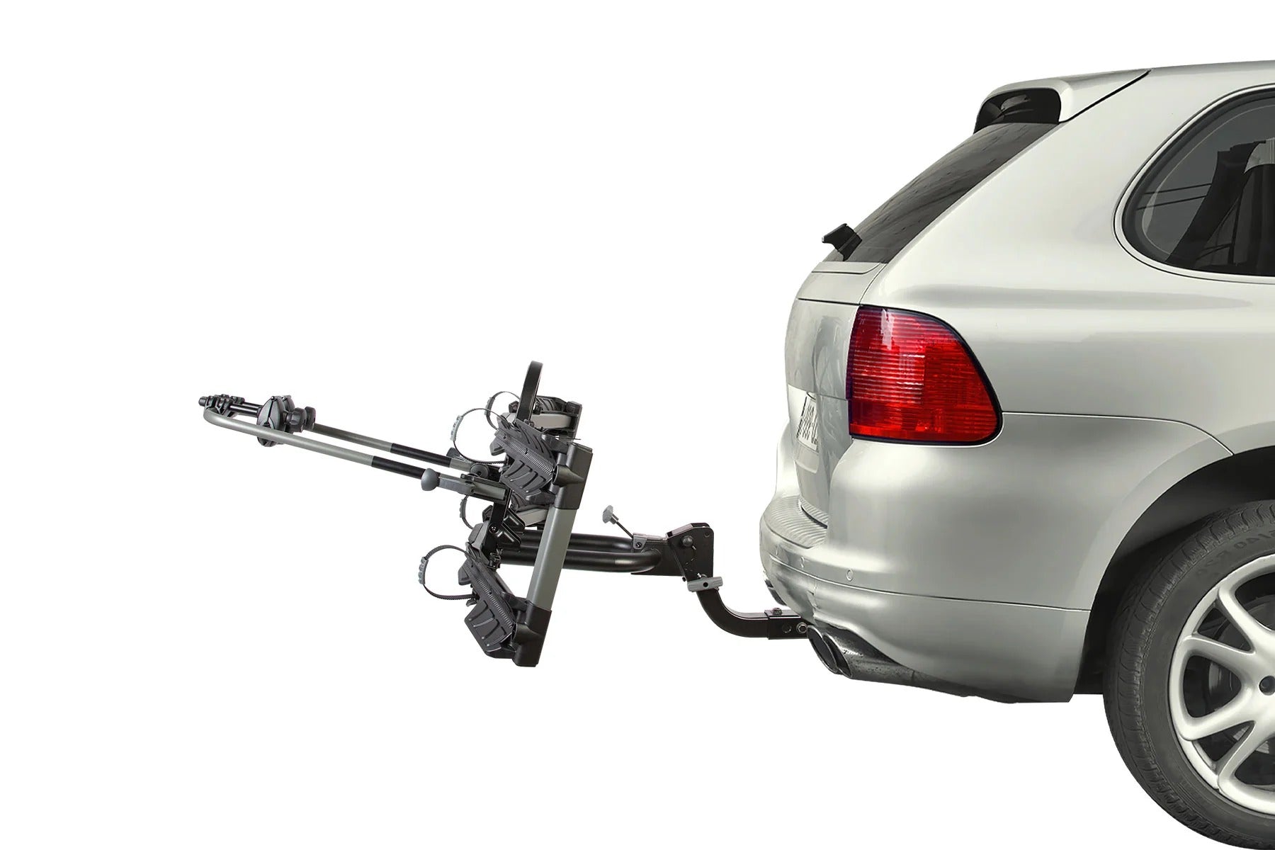 Car with a bike rack attached to the back and tilting down on a white background