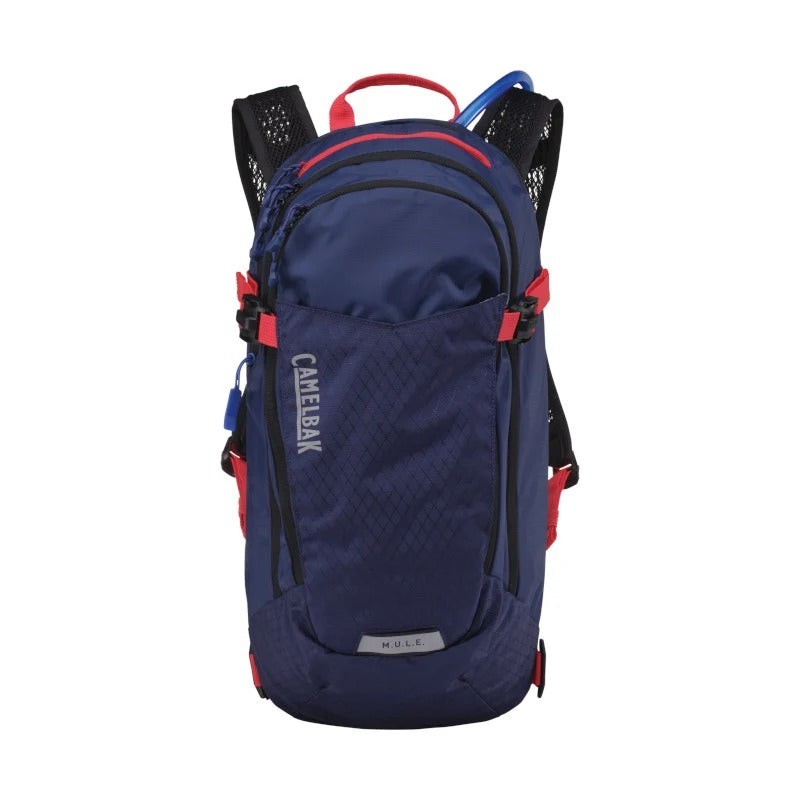 A navy blue CamelBak MULE hydration backpack with red accents and black straps, shown against a plain white background.