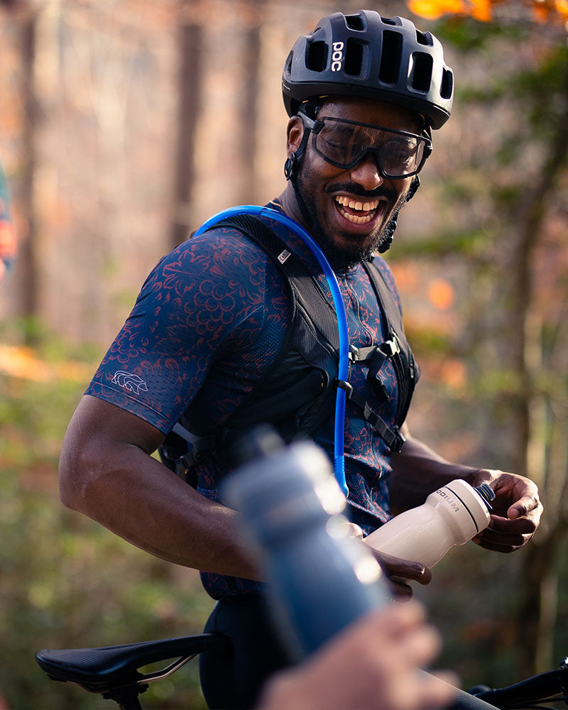 A picture of a cyclist wearing the Camelbak Rogue Light Hydration Pack