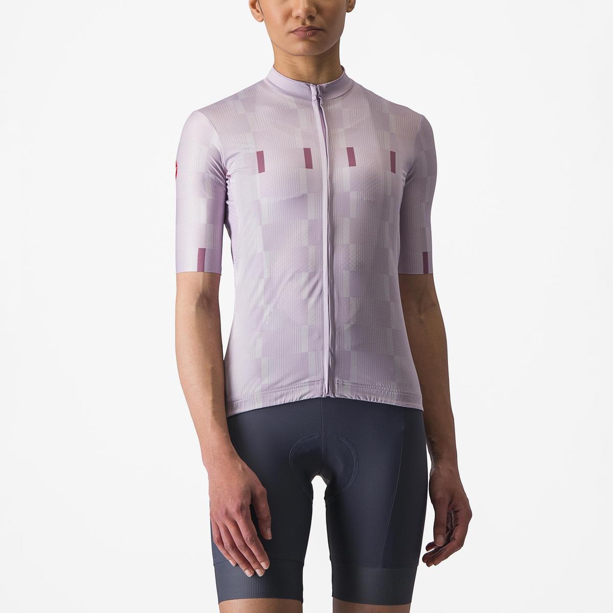 Person wearing a light purple cycling jersey and dark gray shorts on a white background