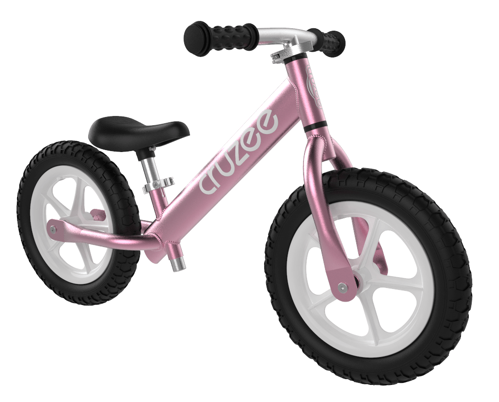 Pink Cruzee Ultralite Balance Bike against a white background